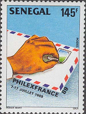 Sticking stamp on envelope